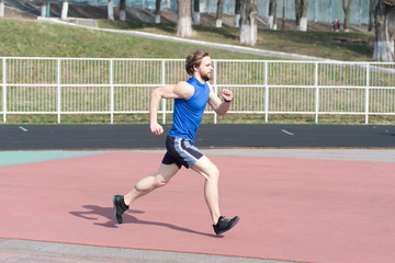 Obraz premium running man in sport arena sunny outdoor
