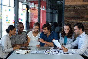 Team of graphic designers interacting with each other