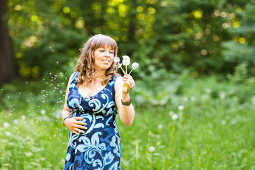 Pregnant woman relaxing and enjoying life in nature. Copyspace