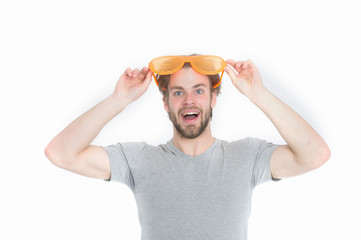 orange party glasses on funny young man in casual shirt