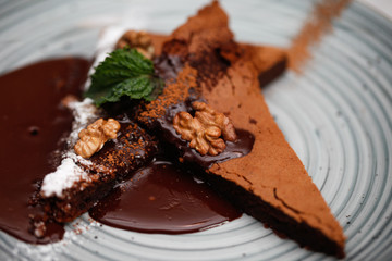 Brownie cake with walnut and chocolate on the plate