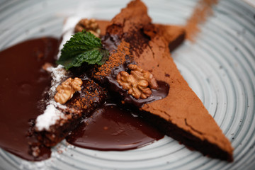 Brownie cake with walnut and chocolate on the plate