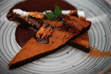 Brownie cake with walnut and chocolate on the plate