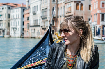 Girl enjoying gondola ride in Venice