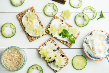 Snack from Wholegrain Rye Crispbread Crackers and Cucumber