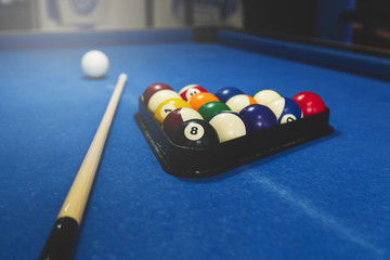 Billiard balls on blue table with billiard cues, Snooker, Pool game.