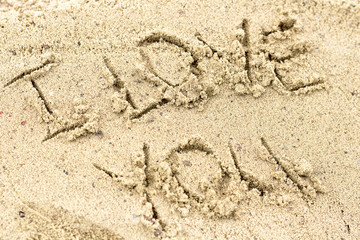 I love you handwritten in sand for natural, love,tourism or conceptual designs