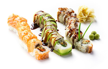 Dragon rolls, wasabi balls, and pickled ginger over white