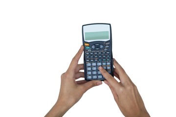 Hand of businesswoman using calculator