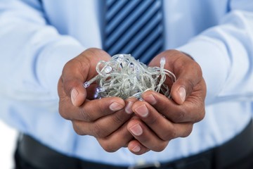 Businessman hands cupped with fairy lights