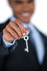 Businessman showing new house key