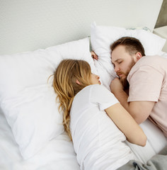 Obraz na płótnie Canvas Couple lovers in the bed