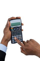 Hand of businessman using calculator