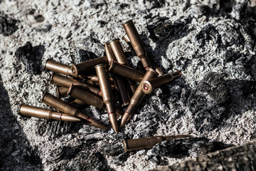 Bullets from AK Kalashnikov AK 47 in heat and coal. Concepts of war, conflict in Syria