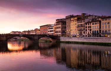 Fototapeta na wymiar colorful Buildings Along the Arno River in Florence Italy