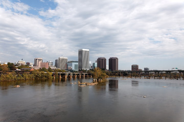 Richmond, Virginia skyline with the James River in foreground.