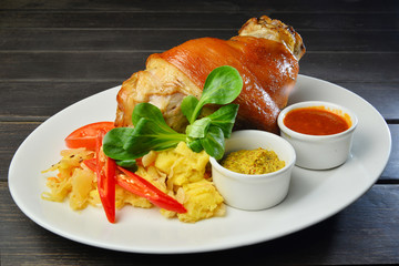 Roasted pork knuckle eisbein with mashed potatoes salad,chili wi