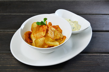 crunchy potato chips with cheese and salad