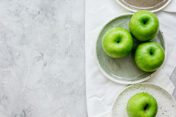 summer food with green apples on stone background top view mock up
