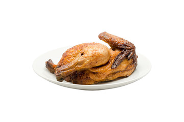 Grilled chicken isolated is placed in a white plate