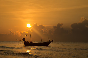 Beautiful Sunset on the beach Yellow Sky with sailing boat