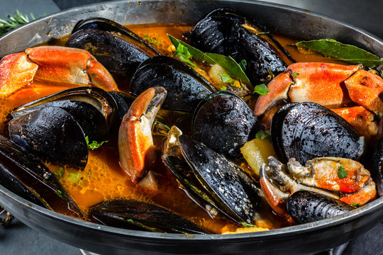 Pot of seafood mussels crabs soup