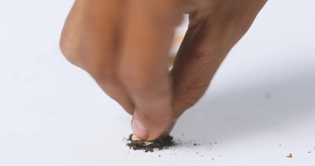 Video footage of a smoker hand putting out cigarette in the studio, isolated on white background. Quit smoking concept. Shot in 4k resolution