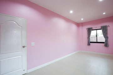 empty pink room with door and window