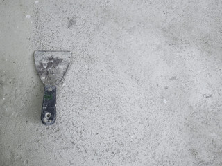 old trowel on a concrete background
