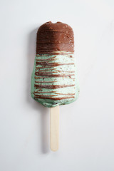 mint flavor ice cream pop lay on white background