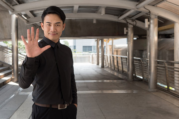 businessman pointing up number 5 finger hand gesture