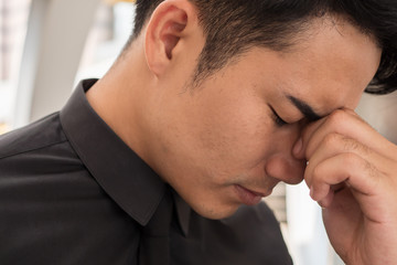 stressful sick businessman having headache, vertigo, migraine, emotional problem