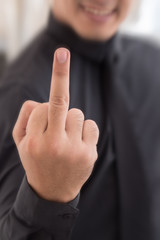 man showing middle finger, rude hand sign