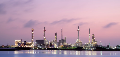 Refinery plant area at twilight with reflection (oil, refinery, industry)