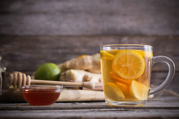  Ginger tea and ingredients on a  grunge wooden background