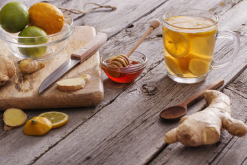  Ginger tea and ingredients on a  grunge wooden background