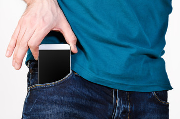 Taking modern smartphone out of pocket.