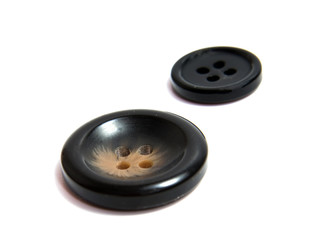 Single brown clothing button isolated over the white background