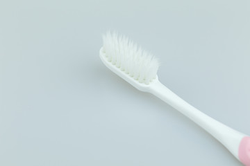 Old Toothbrush used over more than 3 months on white background.