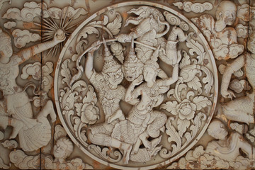 Wall stone carving sclupture of Ramakien Performance in the middle of heaven forest, the glory of Rama story, poster wallpaper background