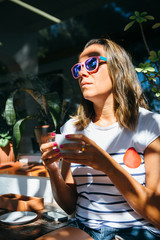 Thoughtful woman with coffee cup