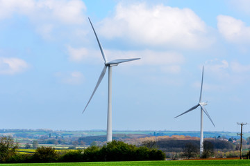 Wind Turbines and Blue Sky with Clouds over UK fields