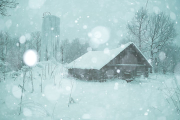 rural landscape with small houses on a snowy day