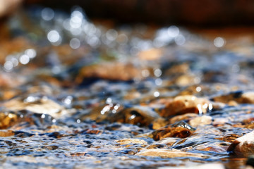 Multi-colored pebbles in a stream