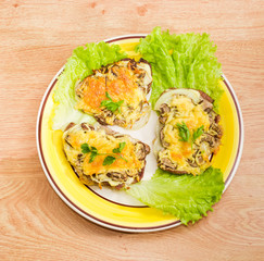 Pork chops baked with onion, mushrooms and cheese