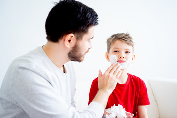 Father and son shaving