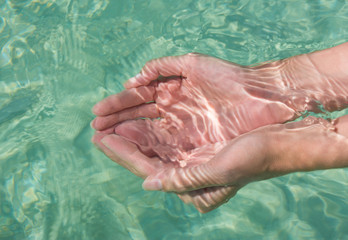 Handful of clear blue water