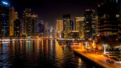 Dubai. In the summer of 2016. Beautiful night lights of ultramodern Dubai Marina on the shores of the Arabian Gulf.
