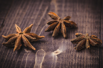 anise on a dark table/anise on a dark wooden table close up
