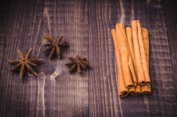 anise, cinnamon for tea on a dark table/anise, cinnamon seasoning for tea on a dark table